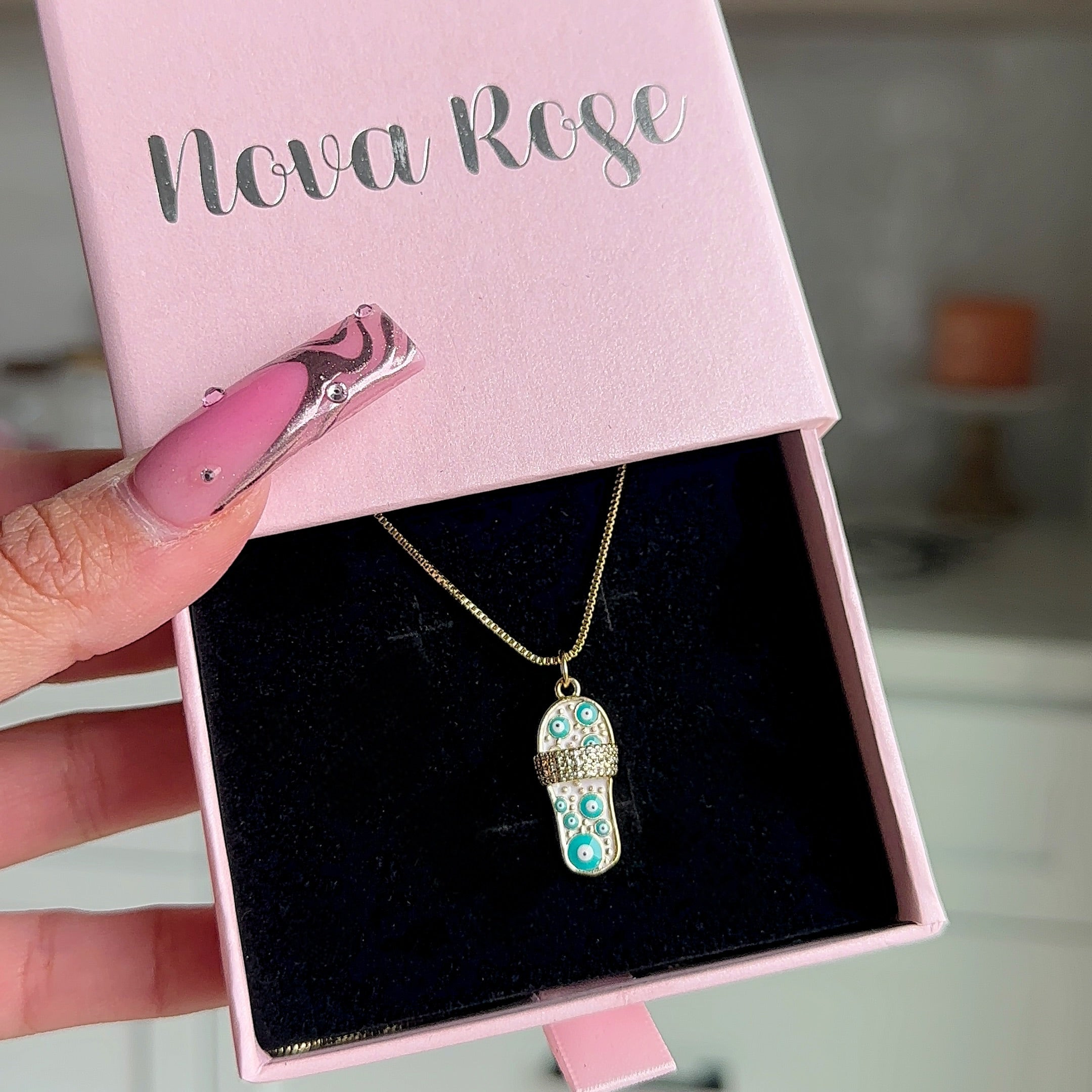 “Evil eye sandal” necklace